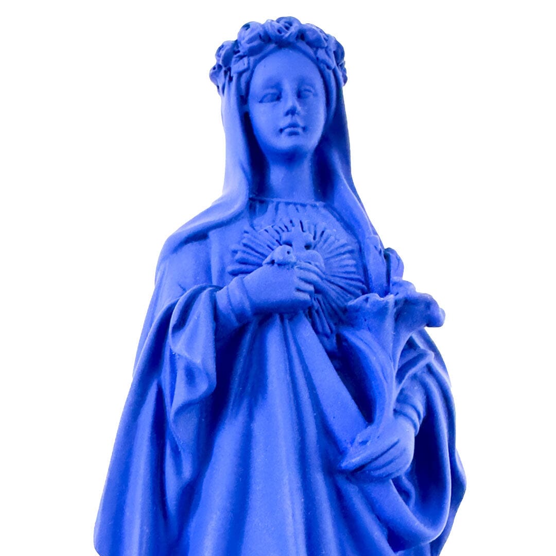 Blue Madonna statue holding a flower with a crown of roses and detailed robes.